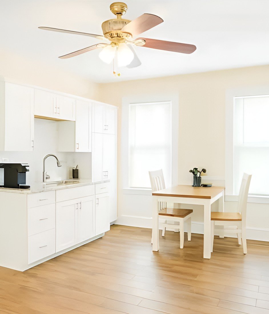 Bright kitchen and dining area with a table and chairs